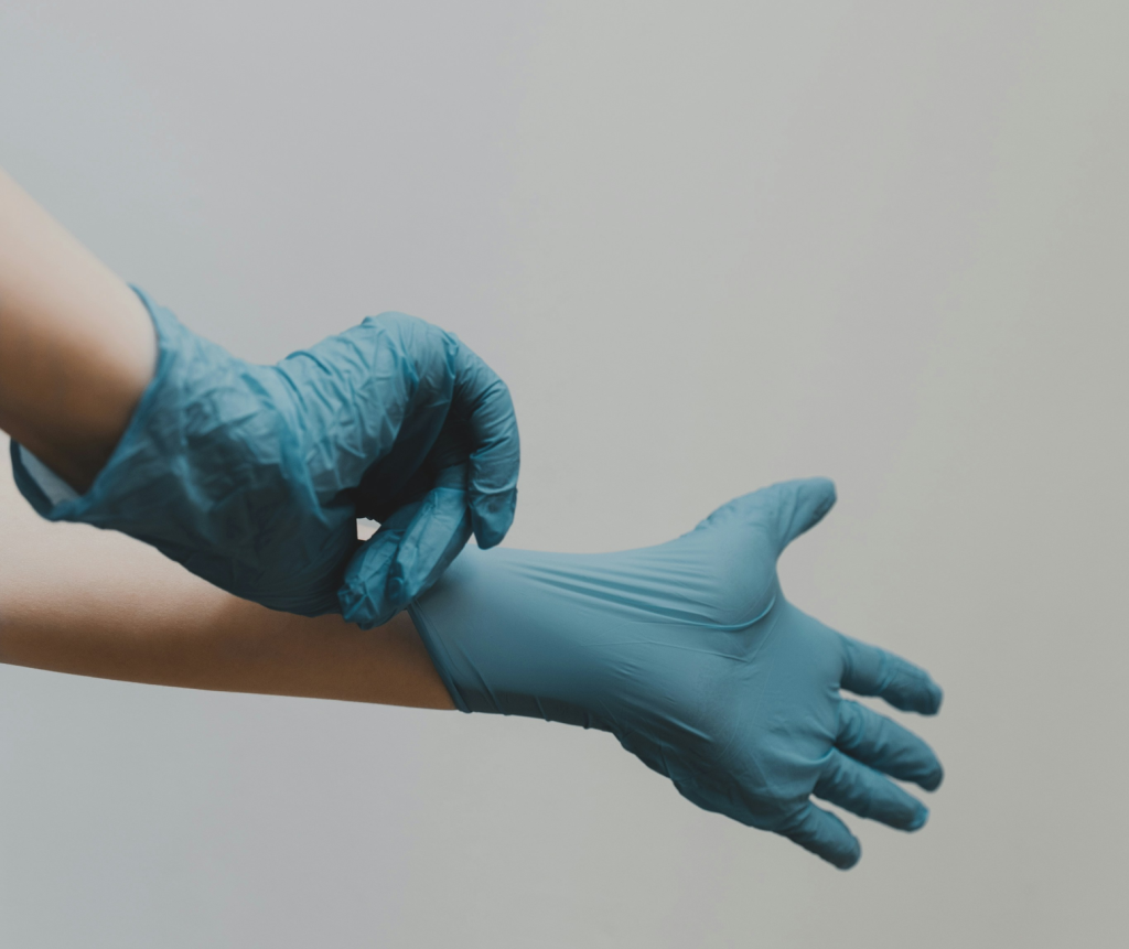 Cleaning professional putting on gloves